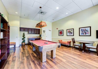 Recreational room with book shelf and billiard table