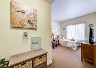 Bedroom with TV , white bed and white sheer window